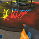 The player sprays a name into the playground floor.